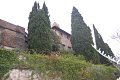 I cipressi e la torre svettano sul lato orientale del castello